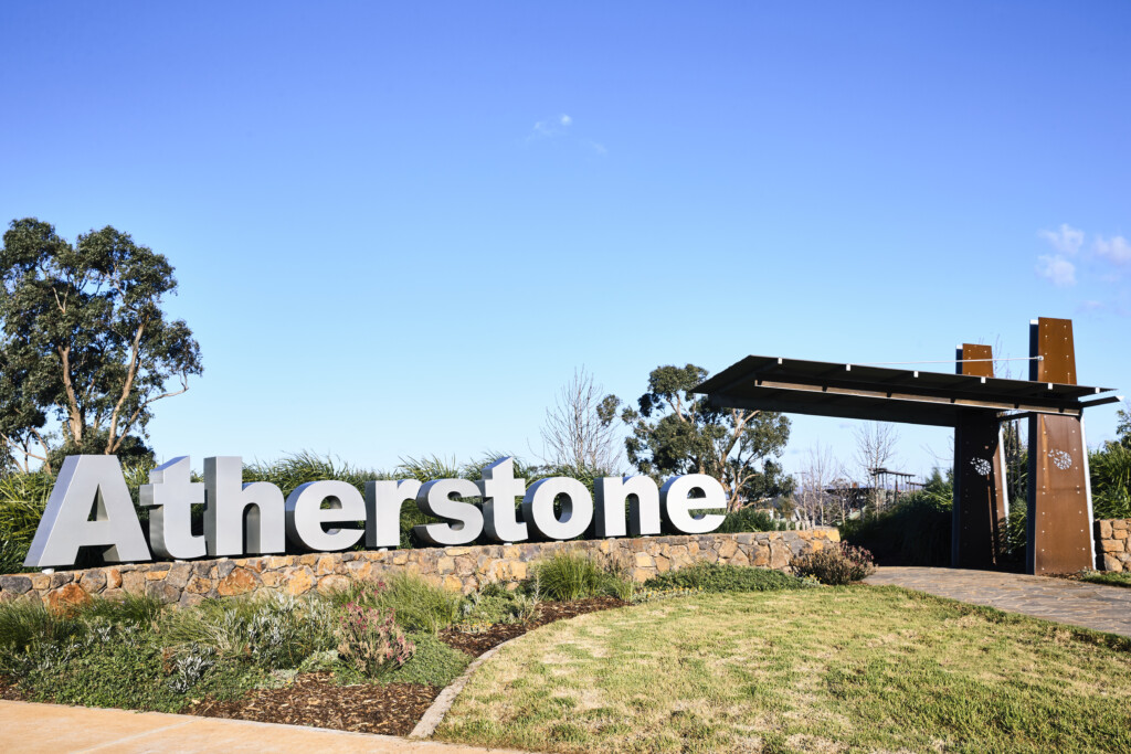 Atherstone estate entrance in Melton South with signage and landscaping, part of Stockland’s new community offering townhouses by Homebuyers Centre.