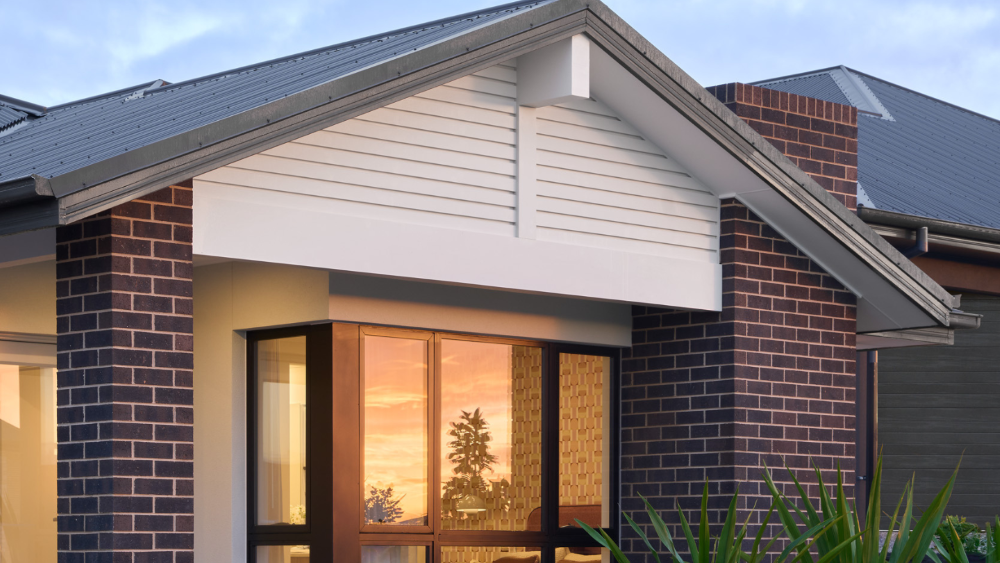 The Industrial colour scheme ties well with the Emerson façade’s mid-century vibe. The dark Monument colour on the roof and window frames pairs perfectly with the Blackrock bricks, which have those rich, moody brown tones. Together, they highlight the unique offset masonry pier and give the whole façade a bold, edgy look that fits the home’s overall style.